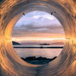 Circular Economy - body of water can be seen through the tunnel