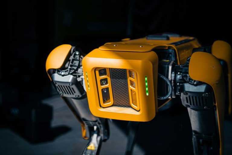 Predictive Maintenance - a close up of a robot that is yellow
