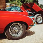 Tire Types - red ferrari car on brown sand during daytime
