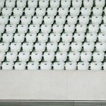 Multiple Retreads - white seats with gray concrete platform