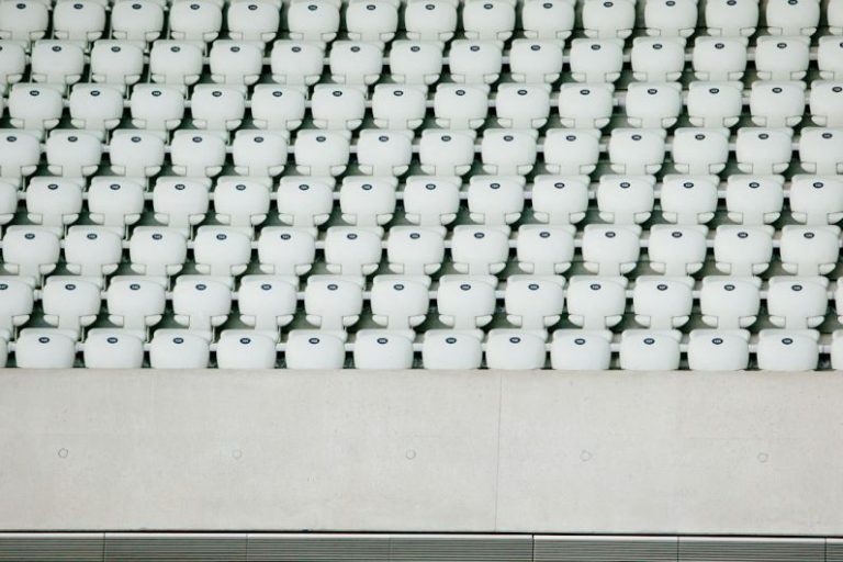Multiple Retreads - white seats with gray concrete platform