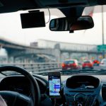 Passenger Cars - man driving vehicle with GPS system turned on