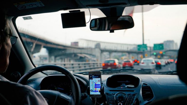 Passenger Cars - man driving vehicle with GPS system turned on