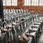 Industry Regulation - a room filled with lots of metal chairs
