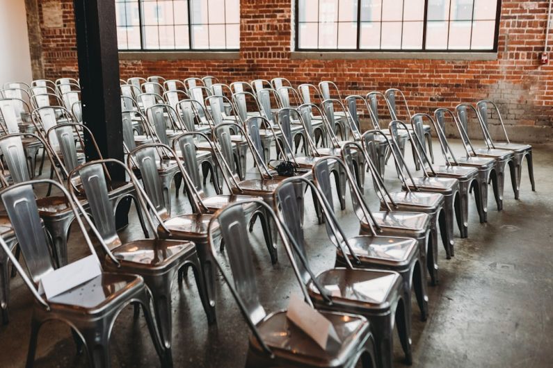 Industry Regulation - a room filled with lots of metal chairs