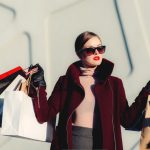 Material Trends - photo of woman holding white and black paper bags