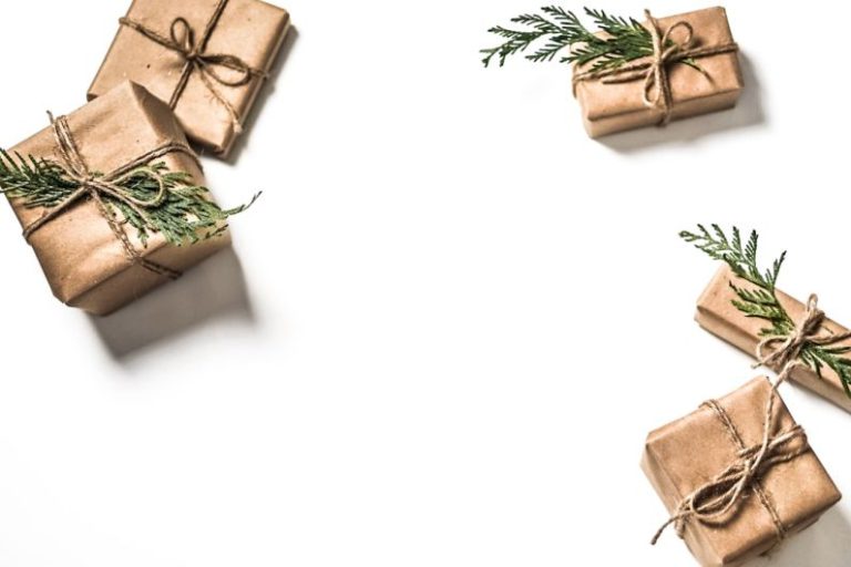 Seasonal Guide - four brown gift boxes on white surface
