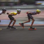 High-speed Tips - man in blue tank top and yellow helmet riding on orange and black motorcycle