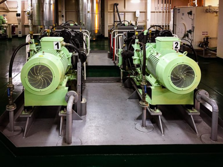 Fuel Efficiency - a couple of green machines sitting inside of a building