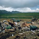 Landfill Reduction - a large pile of trash sitting on top of a dirt field