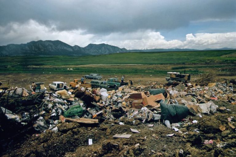 Landfill Reduction - a large pile of trash sitting on top of a dirt field