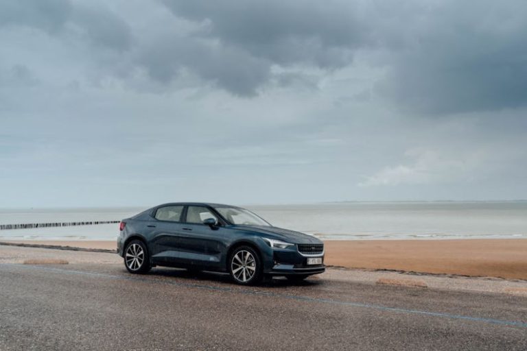 Tire Innovation - black bmw x 6 on beach shore during daytime