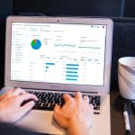 Data Analytics - person using macbook pro on black table