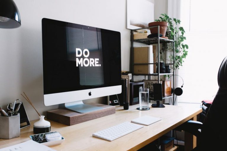 Marketing Strategies - silver iMac with keyboard and trackpad inside room