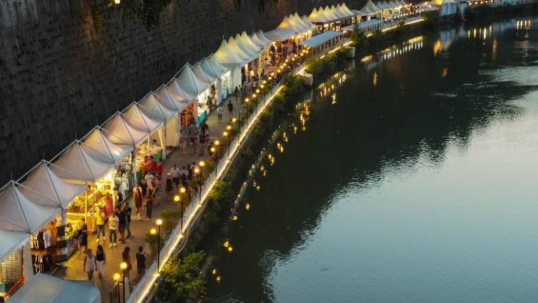 Niche Markets - white canopy with stores near body of water during daytime
